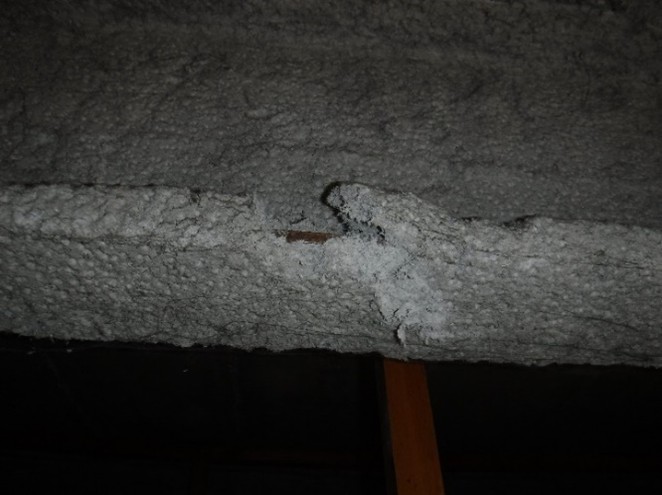 Sprayed asbestos coating (limpet) applied to structural steelwork